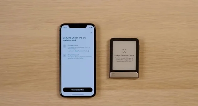 Ledger Live mobile interface showing a 'Genuine Check' and 'OS update check' initiation screen