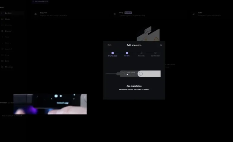Ledger Live interface indicating the installation of a required crypto application.