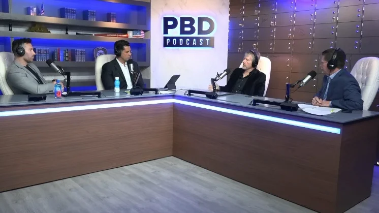 A panel of three men discussing the regulatory status of Ethereum and Bitcoin.