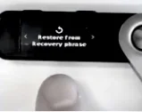 Ledger device showing the 'Restore from recovery phrase' option