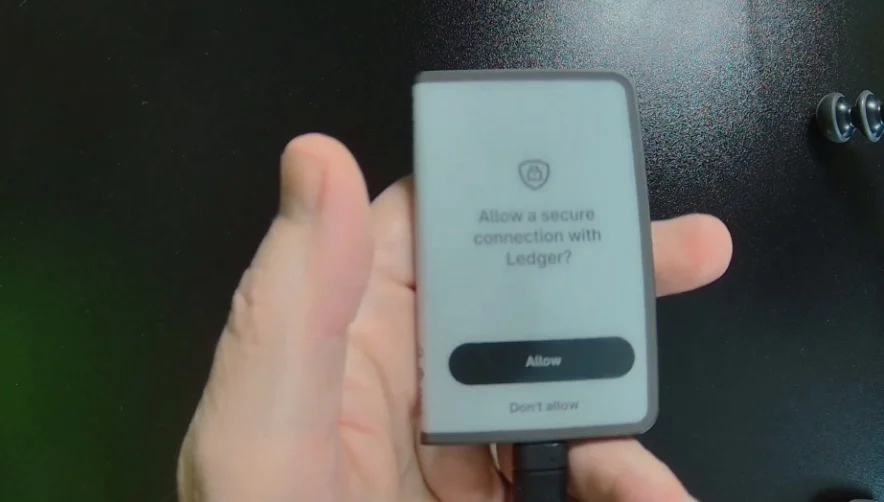 A Ledger device screen asking to confirm a secure connection with Ledger.