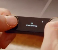 Ledger Nano X screen displaying 'Processing' during the recovery phrase restoration.