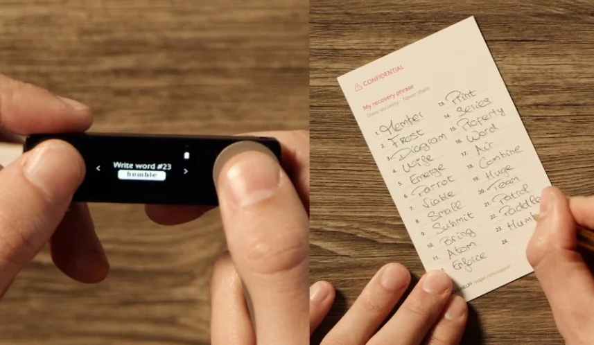 A close-up of a person writing a recovery word on the official Ledger recovery sheet.