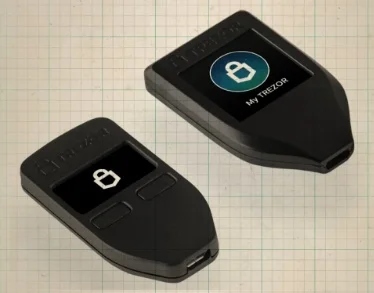 Two Trezor hardware wallets with their logo on display.